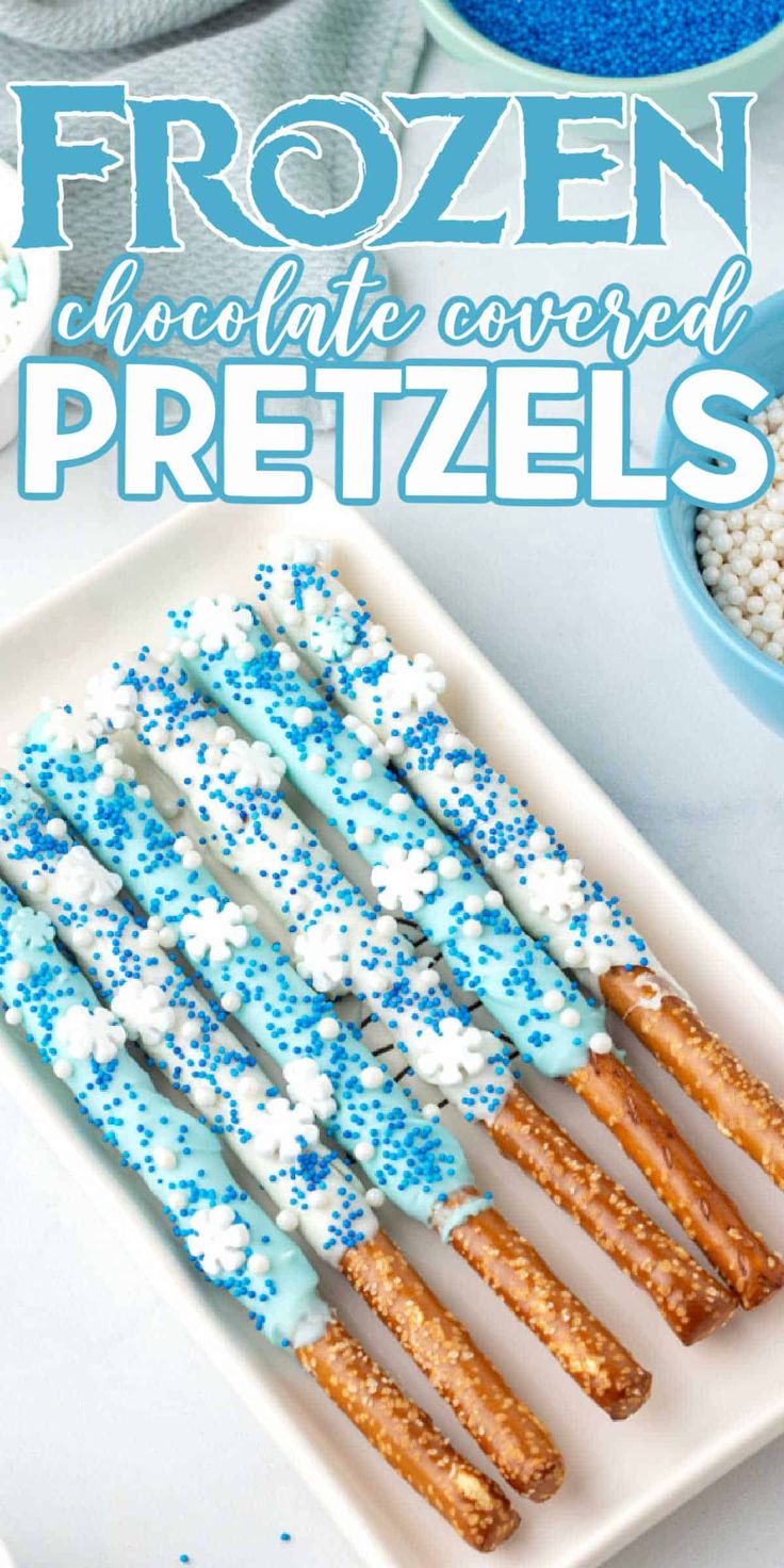 frozen chocolate covered pretzels on a plate with sprinkles and sugar