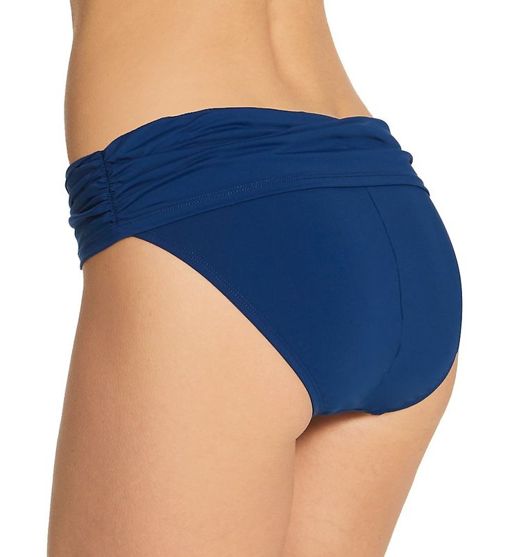 Cute swim bottom sits lower on your hips and has a stylish sarong-style band at the waist. Covered elastic around top edge of waist creates an instant fit. Foldover waistband overlaps at front, with ruched side seams that are sewn in place. Center back seam gives rear a more defined fit. Leg openings have covered elastic to hold fit in place. Mid-rise. Moderate, cheeky rear coverage. Bleu Rod Beattie fabric care tags on inner left side. Front is lined with pique knit, with no additional lining a Blue Swim Skirt For Swimming, Blue Swimwear For Pool, Blue Elastane Swimwear For Poolside, Beachwear Tie-side Bottoms For Swimming, Beachwear Bottoms With Tie-side For Swimming, Ruched Tie-side Bottoms For Poolside, Blue Elastane Brief Swimwear, Blue Elastane Tankini For Pool, Blue Elastane Tankini For Swimming