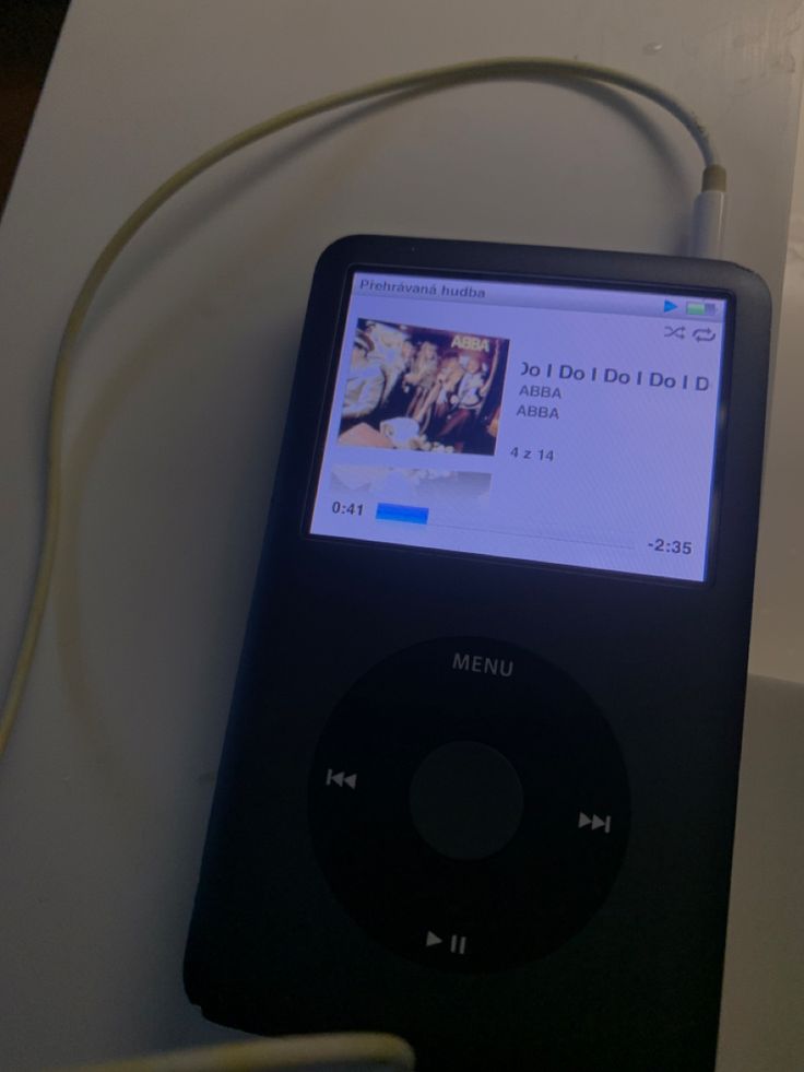 an ipod is hooked up to a charger