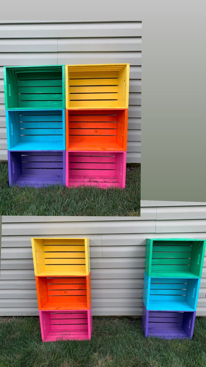 three different colored shelves sitting in the grass