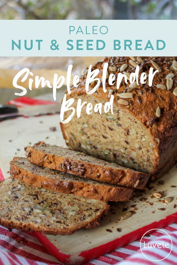 a loaf of nut and seed bread on top of a cutting board with the words, simple blender bread