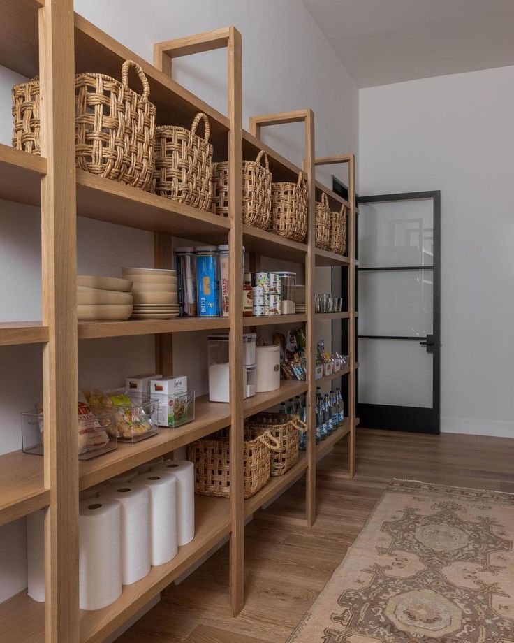 the shelves are filled with baskets and other items