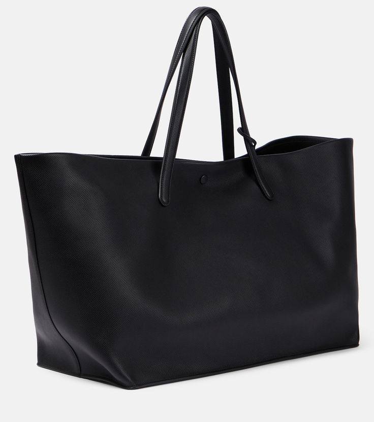 Idaho XL leather tote bag in black - The Row | Mytheresa Chic Leather Bags With Snap Closure, Classic Tote Shoulder Bag With Snap Closure, Workwear Tote Bag With Snap Closure, Modern Business Bags With Snap Closure, Classic Shopping Bags With Snap Closure, Classic Shopping Bag With Snap Closure, Classic Business Bags With Snap Closure, Business Tote Shoulder Bag With Snap Closure, Leather Shoulder Bag With Snap Closure For Business