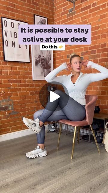 a woman sitting in a chair with a sign above her head that says it is possible to stay active at your desk