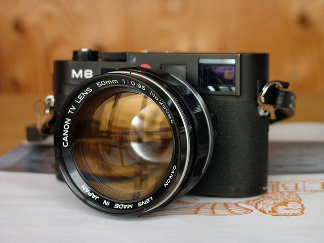 an old camera sitting on top of a table