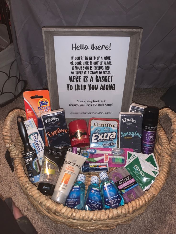 a basket filled with lots of different items next to a sign that says hello there