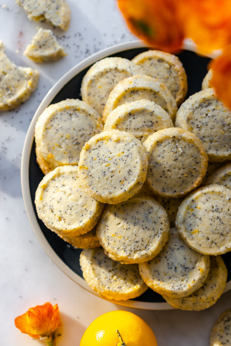 These simple and sweet Lemon Poppy Seed Shortbread Cookies start with a basic, buttery shortbread base. A light and fresh mix of lemon and poppy seeds gets mixed in to brighten the easy slice and bake cookies with sunny flavor. Chicken And Veggie Sheet Pan, Poppy Seed Recipes, Veggie Sheet Pan, Strawberry Pistachio, Poppy Seed Cookies, Shortbread Cookie Crust, Rose Strawberry, Almond Shortbread, Shortbread Cookies Easy