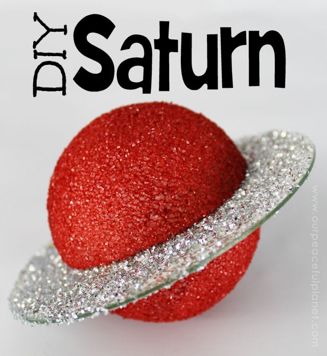 a red ball with silver glitter on it and the words diy saturn above it