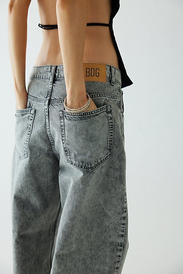 New favorite BDG jean in a classic, rigid denim. Cut in a slouchy relaxed fit with a low-rise that sits comfortably at the hip. Relaxed fit throughout with a loose fit silhouette that tapers ever so slightly toward the puddled hem. Urban Outfitters exclusive. Features BDG Bella baggy jean Slouchy loose fit jeans Crafted with rigid BDG denim Low-rise waist that sits at the hip Slightly tapered silhouette Full puddled length 5-pocket styling Zip fly and button closure UO exclusive Content + Care 1 Baggy Jean, Everyday Fits, Bdg Jeans, Jean Crafts, Loose Fit Jeans, Cute Jeans, Grey Wash, Women Men Shoes, Clothes To Buy