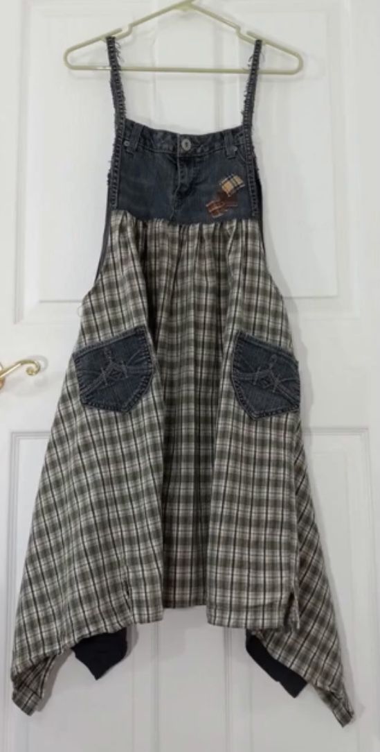 a dress hanging up on a door with some clothes hanging from the front and back