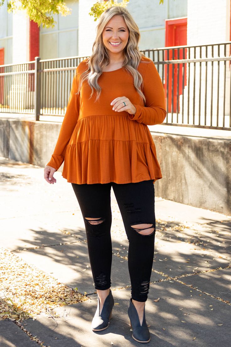 We can't get any closer to the perfect top than this one! This gorgeous ruffled top has a simple design with a figure-flattering baby doll fit you can wear everywhere! Its bold spice color makes it easy to dress up or down for all occasions, while the soft fabric will keep you comfortable all day long! Simply style this top with skinnies and booties for an easy everyday outfit! 95% Rayon, 5% Spandex Chic Peplum Top With Ruffle Hem For Fall, Chic Peplum Top For Day Out In Fall, Chic Fall Peplum Top With Ruffle Hem, Chic Peplum Top For Fall Day Out, Casual Peplum Blouse For Fall, Casual Peplum Top With Ruffle Hem For Fall, Casual Fall Peplum Top With Ruffle Hem, Casual Peplum Tops For Fall, Flowy Top With Ruffle Hem For Fall