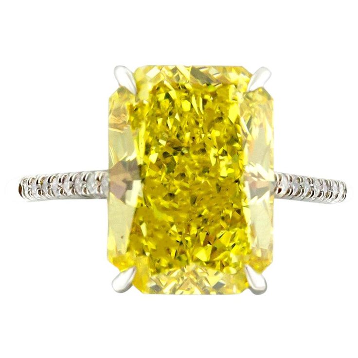 Fancy vivid yellow 5.04 carat rectangular radiant cut diamond engagement ring. Mounted in 2.7g of Platinum with a delicate thin half diamond pave encrusted band. GIA Certified. Certificate No. 6183449015. Size 6.5. Resizing available upon request. Viewings available in our NYC showroom by appointment. Canary Diamond Engagement Ring, Yellow Engagement Ring, Radiant Engagement Ring, Radiant Cut Diamond Engagement Rings, Radiant Cut Diamond Ring, Radiant Engagement, Citrine Ring Engagement, Yellow Diamond Ring, Canary Diamond