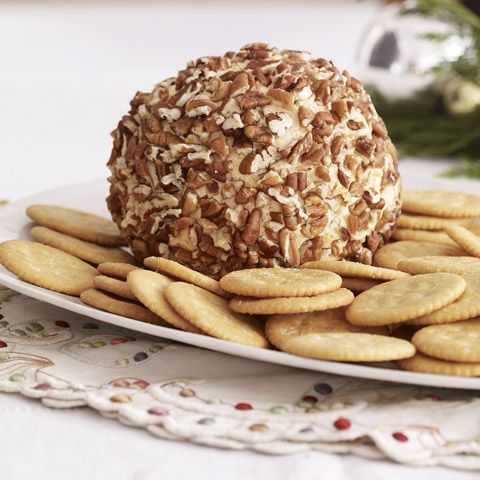 a plate with crackers on it and a large ball of food sitting on top of it