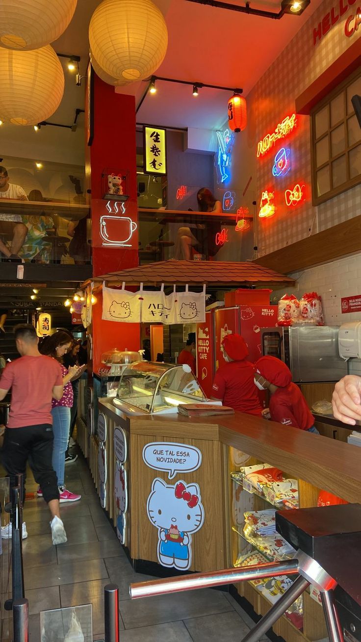 the interior of a chinese restaurant with people walking in front of it and lights hanging from the ceiling