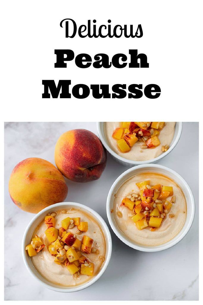 three bowls filled with peaches and topped with whipped cream next to two peaches