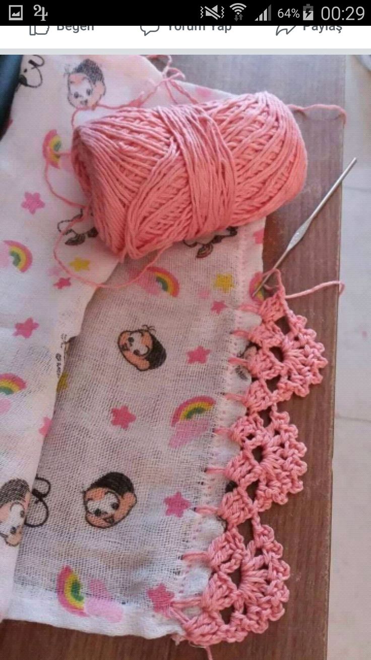 a ball of yarn sitting on top of a table next to crochet hooks