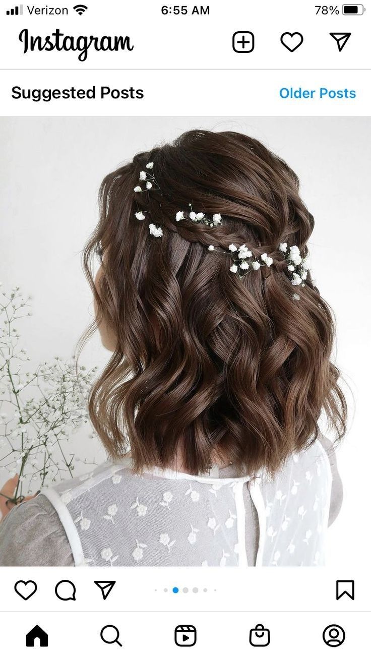 a girl with long brown hair and flowers in her hair is seen on instagram