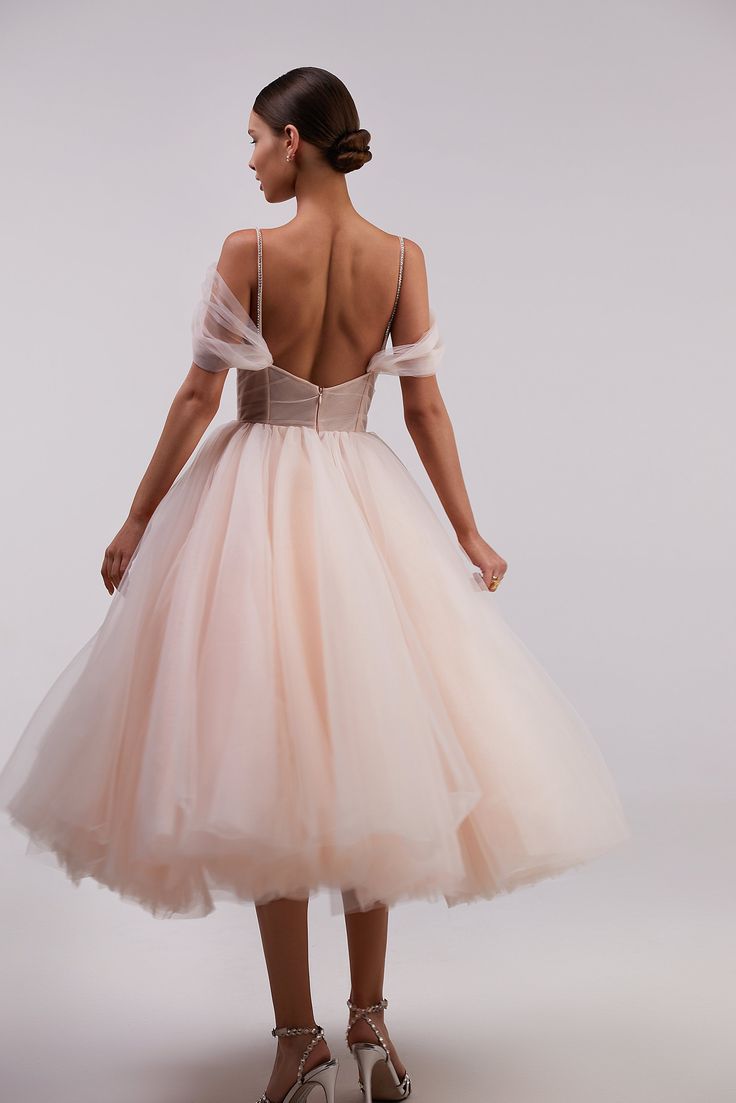 Feminine combination tulle dress with flattering sleeves. Features a peach draped corset with an open back and zipper on the skirt. The plunging neckline is neatly hidden with the decorative insert of transparent mash covered by dozens of sparkling beads. The gown is designed with off-the-shoulder tulle sleeves and tender sparkling tie straps. The A-line midi skirt makes you look elegant and impressive. The dress goes in peach color. Where to wear this feminine midi tulle dress with plunging nec Tulle Corset Dress, Midi Tulle Dress, Draped Corset, Cocktail Dress Code, Tulle Cocktail Dress, Tulle Sleeves, Tulle Fabric, Engagement Photo, Corset Dress