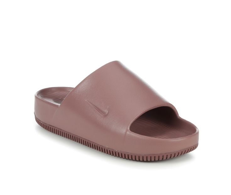 a women's nike slide on sandal in dusty pink with an open toe