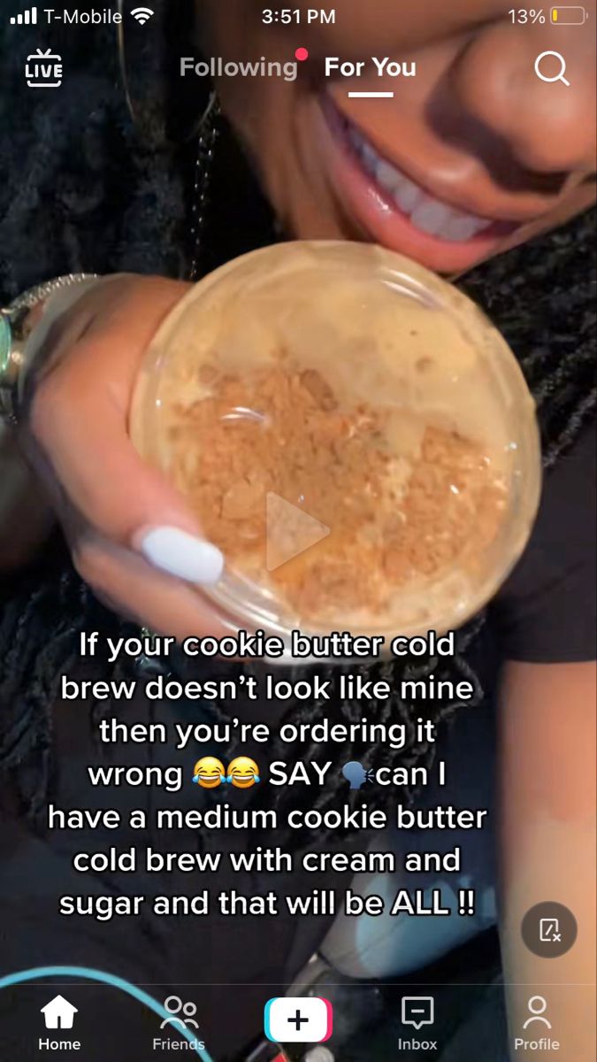 a woman holding a bowl of food with the caption'if your cookie butter cold brew doesn't look like mine, then you're ordering it wrong