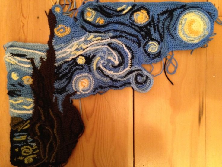 a crocheted piece of art that looks like the starry night sky is hanging on a wall