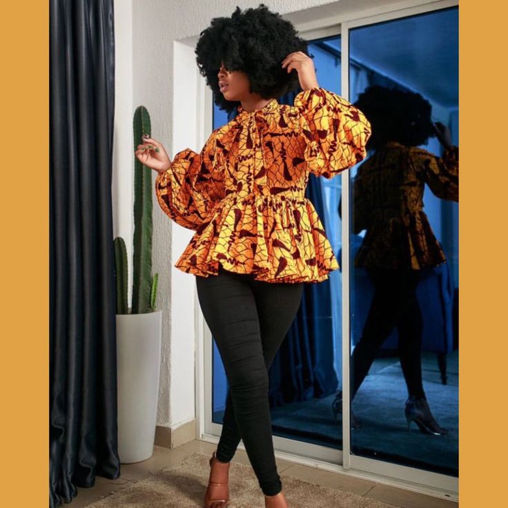 Maeotti Figure-Flattering African Ankara Print Bibi Blouse Featuring A Bright, Honey Yellow Cotton Fabric With A Black, Red, And Gray Print. This Blouse Was Designed For A Naturally Curvaceous Physique With A Peplum Waist, Exposed Matching Full Zipper Back With Decorative Zipper Pull, Clear Button Back Neck Closure, Mock Turtleneck With Extra Long Ribbon Tie, And Extra Long Bishop Sleeves. * Top Is Unlined * Has A Long Back Zipper * Puff Sleeve With Elastic Band * Has A Fancy Bow At The Neck * C Pink Maternity Dress, Kente Dress, Pixie Dress, Fancy Bows, Wedding Photo Props, 1920s Flapper Dress, Free Fabric Swatches, Floral Peplum, African Print Fashion