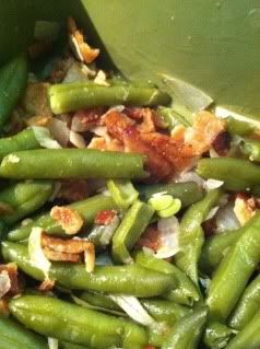 green beans with bacon and onions in a bowl