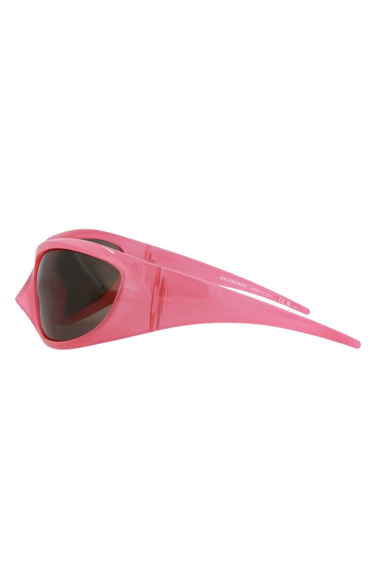 The future is now and bright enough to justify the wrapped, tinted lenses that shade these dynamic Italian-made sunglasses designed for terrestrials. 80mm lens width; 18mm bridge width; 110mm temple length 100% UV protection Injection frame Nylon lens Made in Italy Futuristic Outdoor Shield Sunglasses With Tinted Lenses, Modern Pink Shield Sunglasses With Mirrored Lenses, Futuristic Polarized Sunglasses For Outdoor Use, Modern Pink Shield Sunglasses With Polarized Lenses, Modern Plastic Shield Sunglasses With Tinted Lenses, Futuristic Cat Eye Shield Sunglasses With Tinted Lenses, Modern Tinted Shield Sunglasses, Modern Pink Shield Sunglasses With Tinted Lenses, Modern Pink Tinted Shield Sunglasses