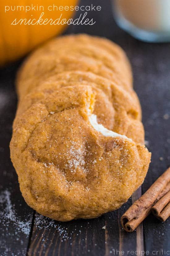 pumpkin cheesecake snickkeddoodles on a wooden table with cinnamon sticks