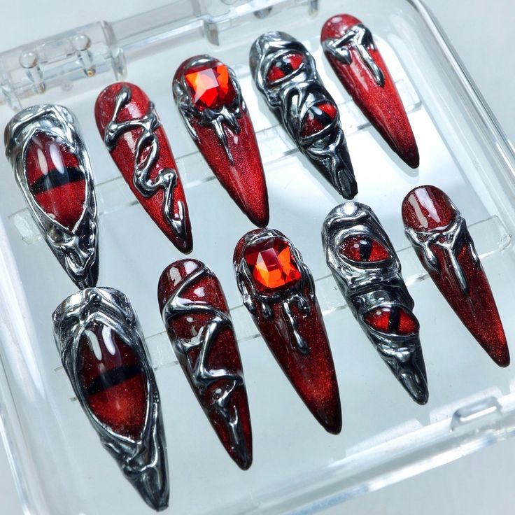 Make a bold statement with our Red Chrome Eyes design—fierce, glossy, and irresistibly striking. 🔴✨ -- This set is now available on my site! 🛍️ Don’t miss out — head over to check your sizing and design preferences to make checkout a breeze and snag your perfect set! -- #donailsart #darknails #pressonnails #nailsdesign #halloweennails #gothicvibe Red And Chrome Acrylic Nails, Horror Nails, Spooky Nails, Red Chrome, Dark Nails, Nail Nail, Eyes Design, Eye Design, Fancy Nails