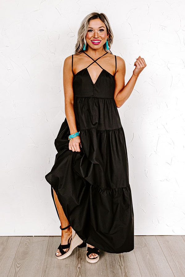 - Perfect for a sunny day, this beautiful dress is a trendy option for your maxi dress selection! - An unlined lightweight material - A v-cut neckline - Spaghetti straps as well as a second pair of spaghetti straps with front crisscross detail - Hidden side pockets - A flowy tiered silhouette that ends in a straight ankle length hemline Black V-neck Maxi Dress For Date Night, Black Maxi Sundress For Party, Black Summer Maxi Dress For Party, Summer V-neck Maxi Dress For Date Night, Black Sundress For Spring Beach Occasion, Black Beach Sundress For Spring, Chic Black Maxi Dress For Vacation, Summer Maxi Dress For Date Night, Black Sundress For Spring Party