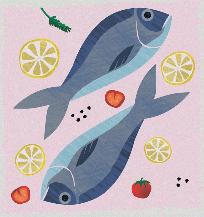 two fish with lemons and tomatoes on the side