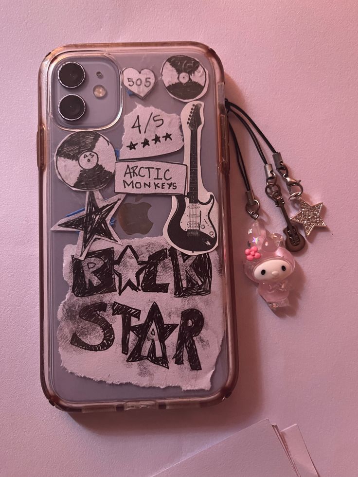 an iphone case with the words bead star on it and charms attached to it