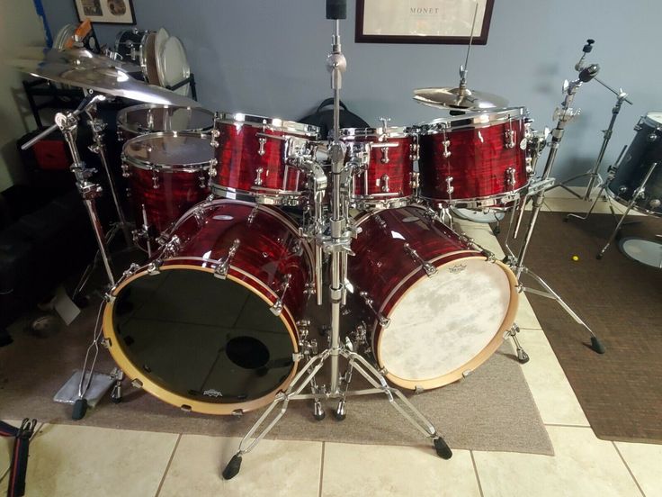 a red drum set sitting on top of a floor