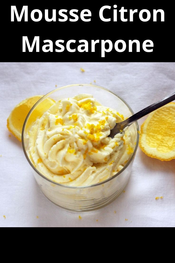 a glass bowl filled with mascarpone next to an orange slice