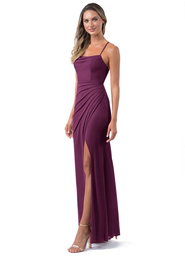 a woman in a long purple dress with one leg slited up and the other side split