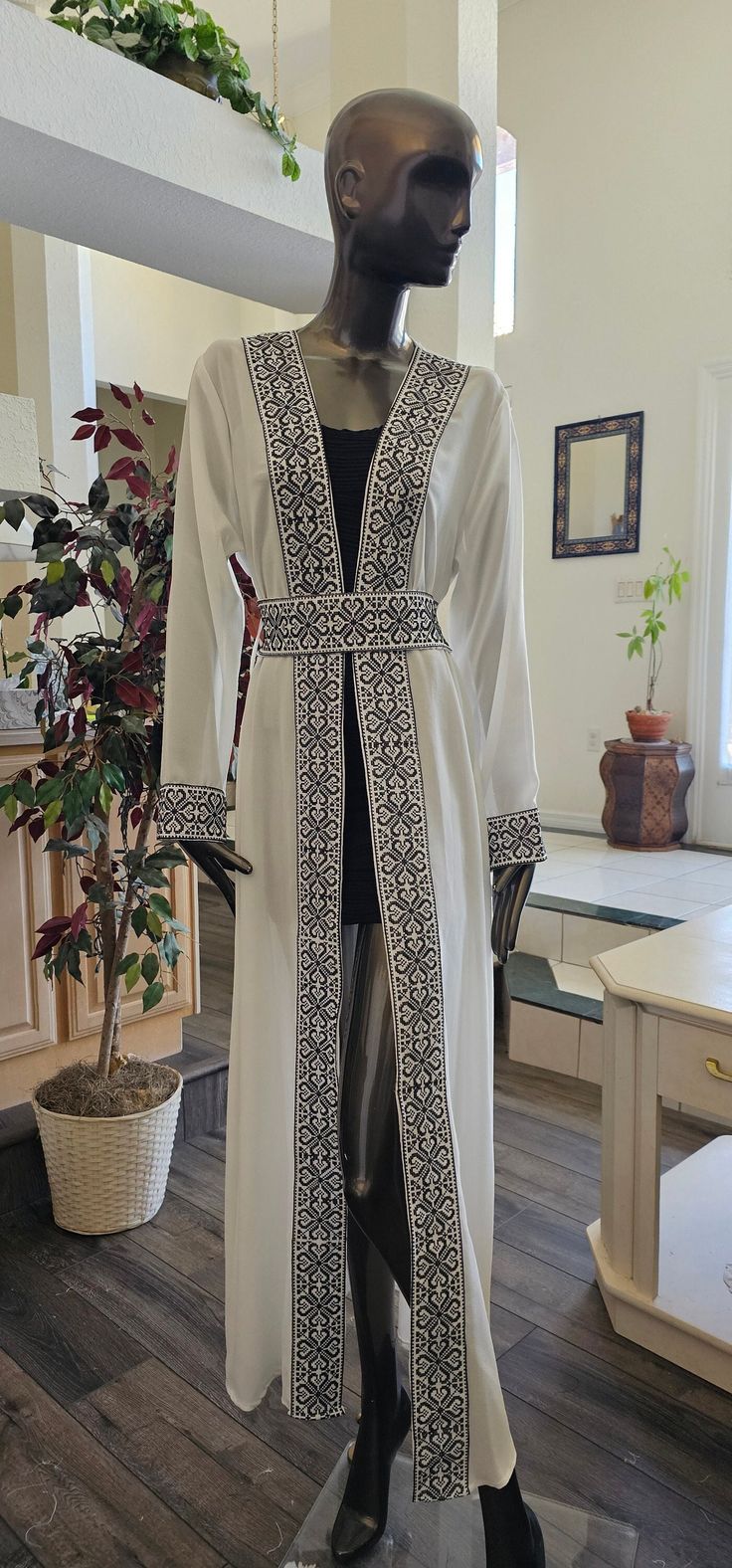 Basic information: White Chiffon Abaya / Kaftan / Thobe / Dress with Black Embroidery/Tatreez Modern Style with Embroidered / tatreez belt - Color : White & Black embroidery - Condition : NEW - Price : 65$ - size : 1 (Fits Small & Medium) Shoulders: 16" inches Sleeves Length: 24" Inches Abaya Length: 58" Inches - size : 2 (Fits Small & Medium) Shoulders: 16.5" inches Sleeves Length: 24" Inches Abaya Length: 58" Inches - Shipping : Free with USPS Priority Mail Shipping - No Returns & Exchange Acc Jordanian Dress, Dress Kaftan, Black Embroidery, Arab Women, Abaya Dress, Kitenge, White Chiffon, Dress Clothes For Women, Priority Mail