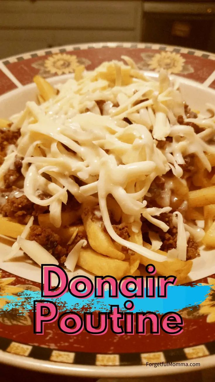 a plate filled with pasta and sauce on top of a table