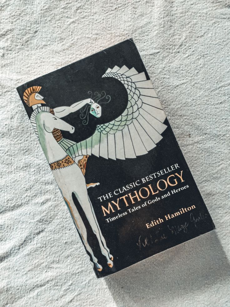 a book about mythology on a white background