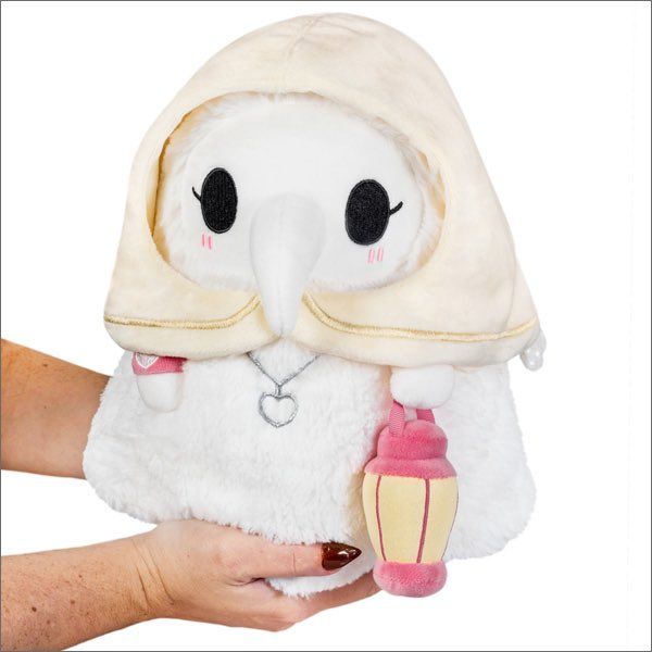 a person holding a stuffed animal with a hood on it's head and eyes