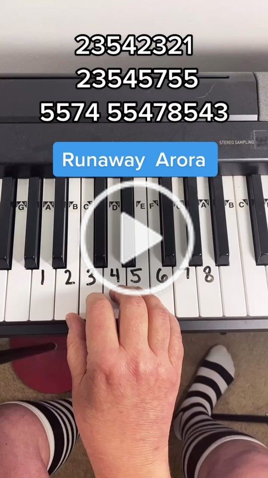 someone is playing the piano with their fingers and thumbnails on top of it