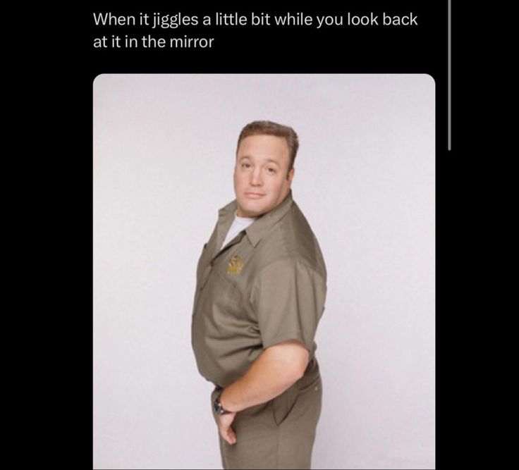 a man is standing in front of a white background with the caption, when it giggles a little while you look back at it in the mirror