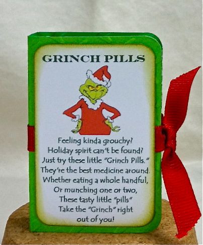 the grinchplis sign is on top of a rock with a red ribbon around it