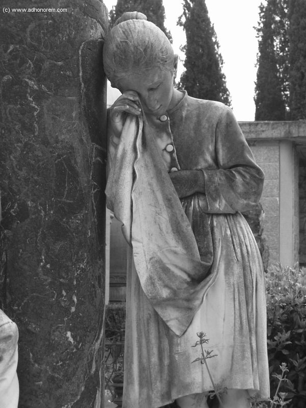 an old black and white photo of a woman leaning against a stone pillar with her hands on her face