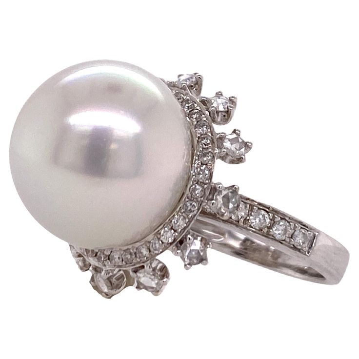 Beautiful South Sea Pearl and diamond ring fashioned in 18 karat white gold. The 14.5mm South Sea Pearl is surrounded by diamonds weighing 1.00 carat total weight and graded G-H color and SI clarity. The ring is currently sie 5.5 (can be sized). Ornate Ring, Diamond Bracelet Design, Pearl Rings, Pearl And Diamond Ring, Luxe Jewelry, Fine Diamond Jewelry, Diamond Fashion Rings, Gold Cocktail Ring, Gold Cocktail