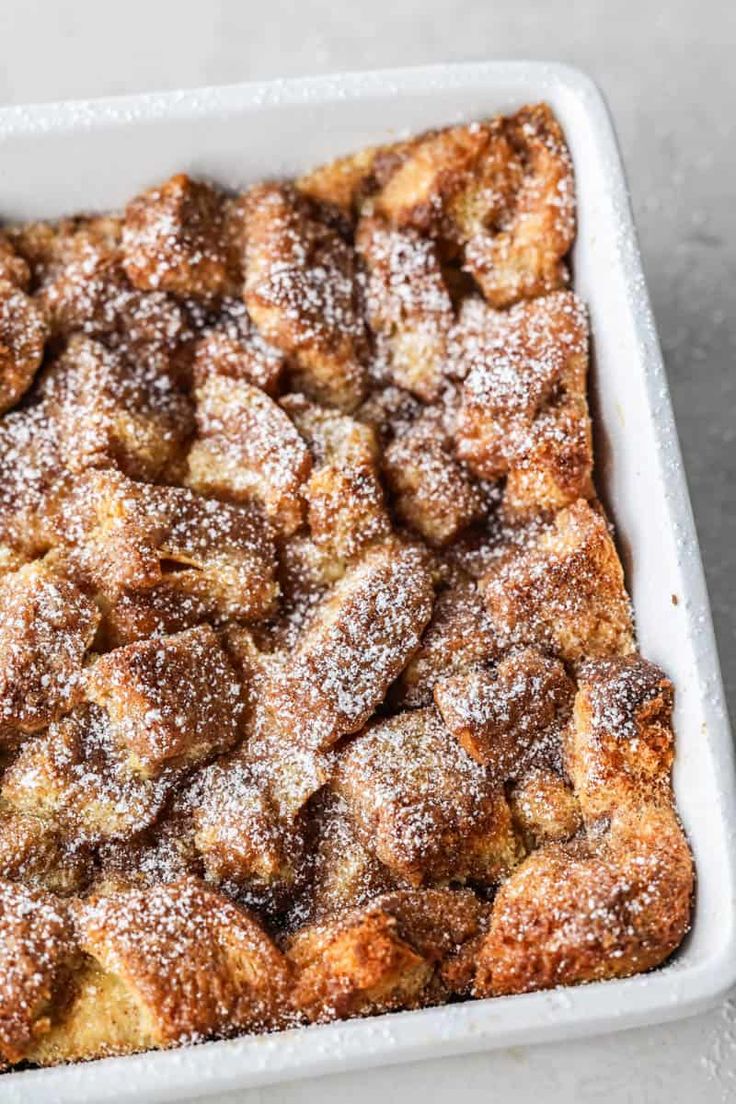 a square white dish filled with powdered sugar