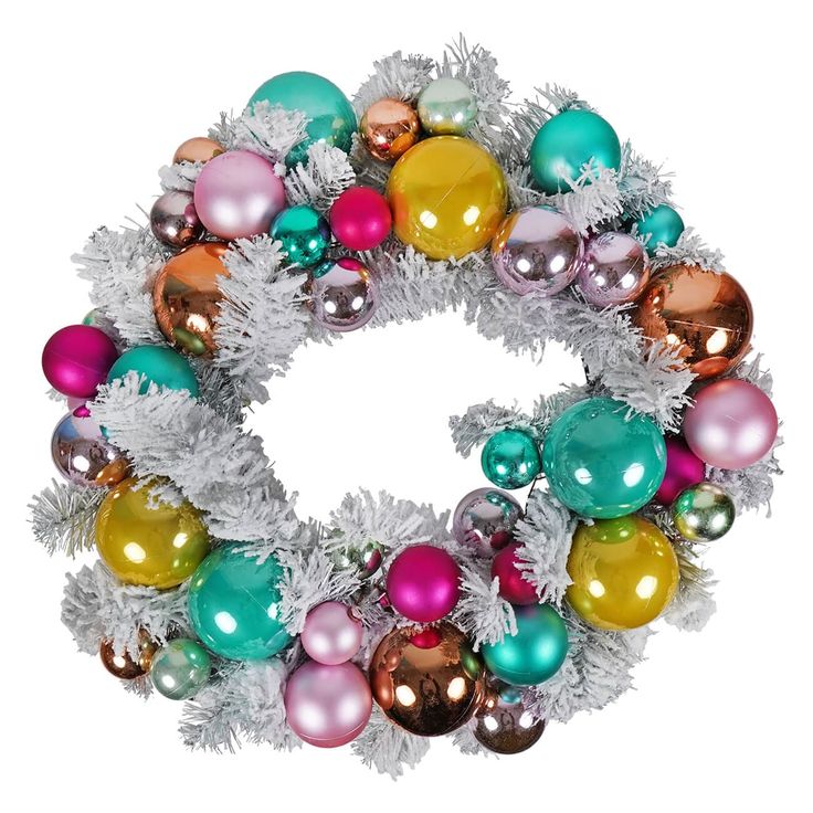 a christmas wreath with ornaments and tinsel on it, isolated against a white background