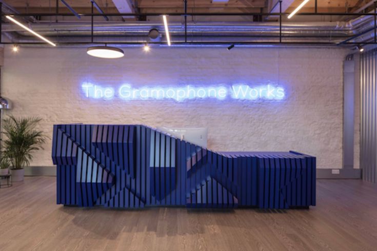 the reception desk is made out of blue corrugated