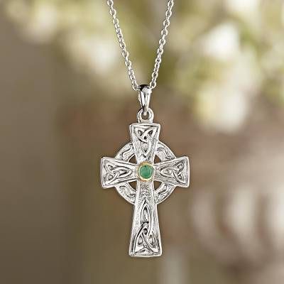 As early as the eighth century elaborate Celtic crosses were erected as monuments throughout Ireland and Scotland. Since the Celtic Revival of the 19th century the ornate designs have become a widely recognized symbol of Irish heritage. Our sterling silver necklace includes a small natural emerald at the center framed in 14-karat gold. Spiritual Cross Necklace With Intricate Design, Spiritual Cross Jewelry With Intricate Design, Sterling Silver Cross Necklace With Intricate Design, Traditional Cross Pendant Necklace With Intricate Design, Byzantine Cross Necklace With Engraving, Traditional Necklace With Intricate Cross Pendant, Byzantine Cross Sterling Silver Jewelry, Silver Filigree Cross Necklace, Byzantine Style Sterling Silver Cross Pendant Jewelry