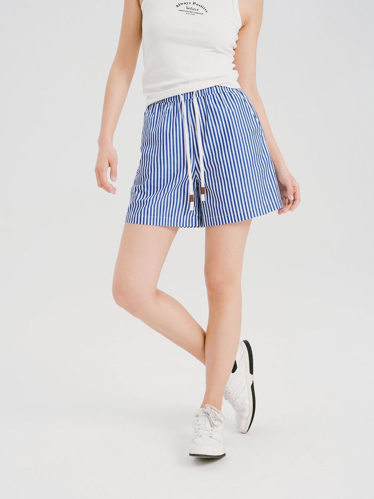 Details: Blue and white striped shorts full of seaside resort style Cotton sense clashing color drawstring and leather accessories, natural and textured Made of pure cotton, soft and comfortable to the touch Side pockets, loose hem, small A-line shape Materials & Care: Cotton 100% Hand wash | Dry clean Do not bleach Size & Fit: Model is 5'7", Bust 32, Waist 24, Hips 35, wearing a size S Item #: WM2PA19 Blue Striped Hem Bottoms For Summer, Summer Blue Bottoms With Striped Hem, Casual Blue Bottoms With Striped Hem, Blue Summer Bottoms With Striped Hem, Summer Cotton Bottoms With Striped Hem, Striped Cotton Shorts For Day Out, Striped Cotton Shorts For Vacation, Striped Cotton Shorts For Beach Season, Sporty Striped Hem Bottoms For Summer